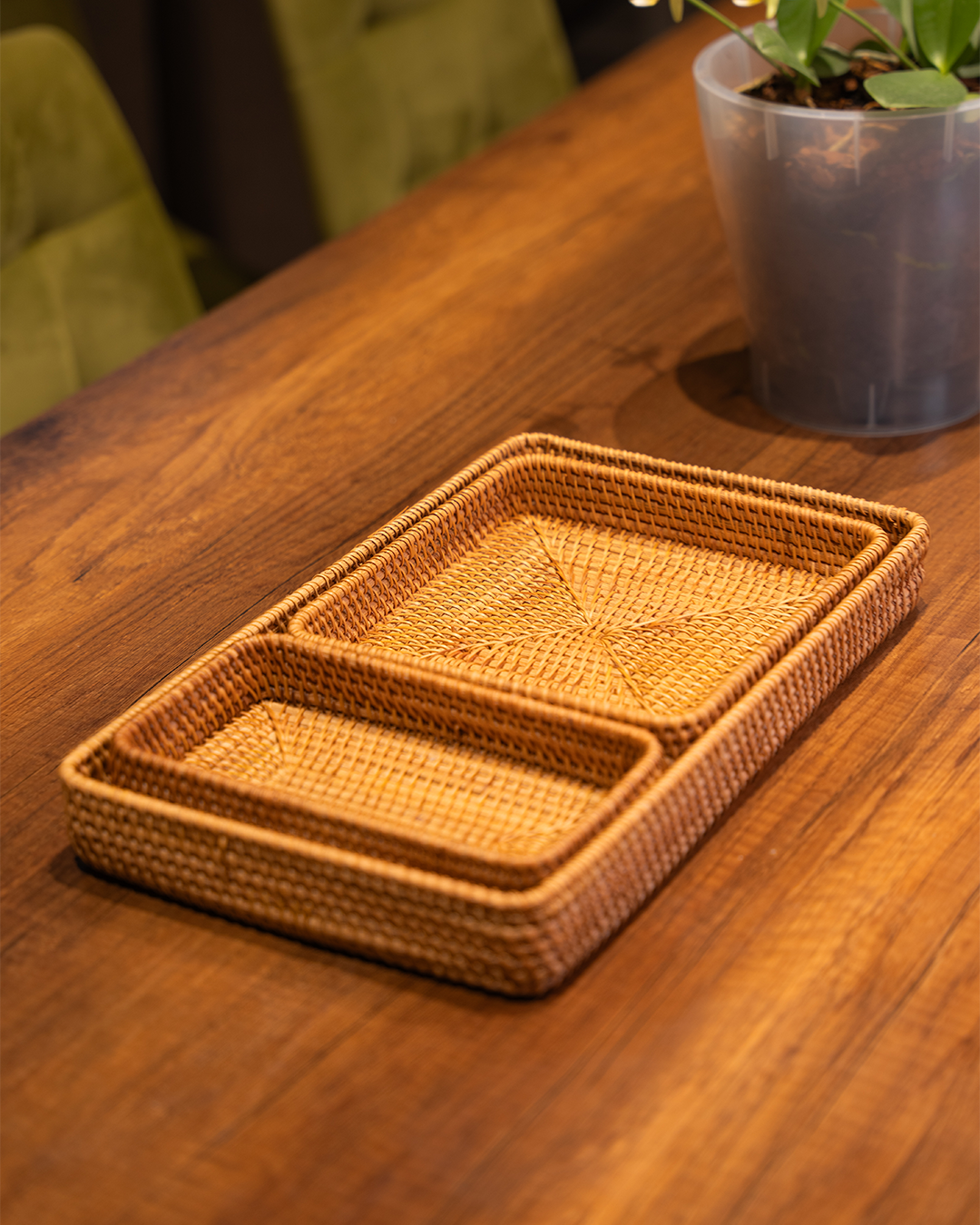 Handwoven rattan tray set styled with lemons and nuts
Rattan trays stacked on dining table
Detail shot of wicker weave texture
